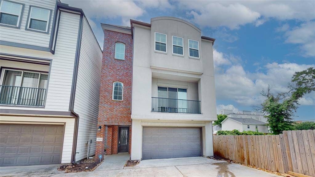 Modern multi-story home with a rooftop terrace and best of all - no side neighbors! Ideal for those seeking a contemporary living space.