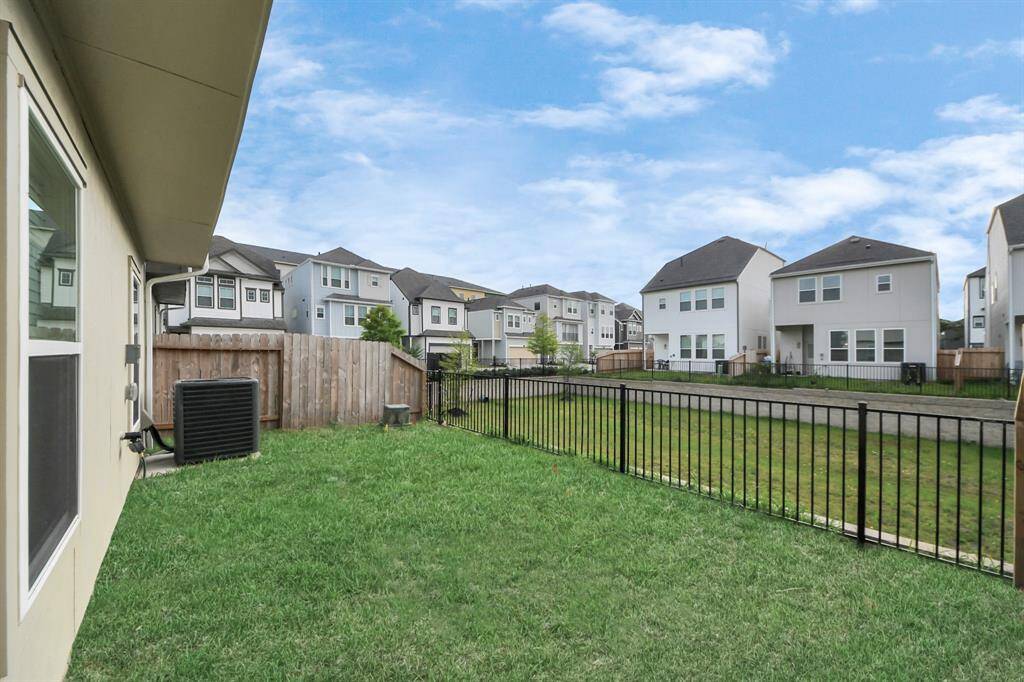 Your Own Private Green Space — Without the Hassle. This cozy backyard offers just the right amount of space to relax, entertain, or enjoy a sunny afternoon with your furry friend (pet under 10 lbs welcome!). With a wrought-iron fence and low-maintenance lawn, this outdoor area is perfect for those who want the benefits of a yard without spending weekends mowing. Benefits: easy upkeep = more time to chill; ideal for morning coffee or sunset vibes; and great for small pets who love fresh air.