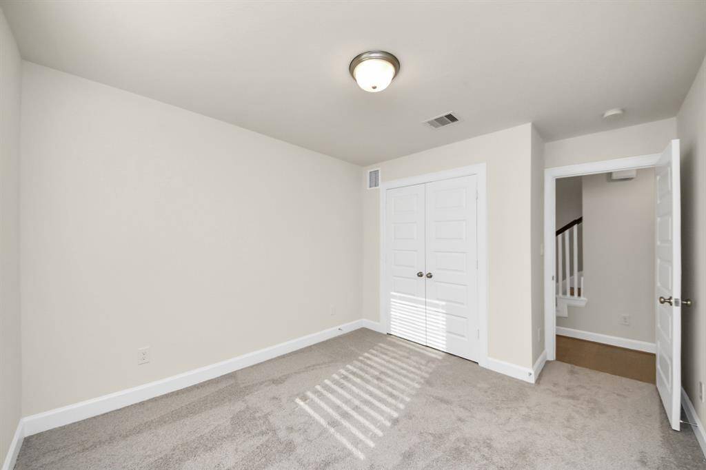 Flexible Space with Natural Light - This first-floor secondary bedroom offers flexibility for your lifestyle—perfect as a guest suite, home office, creative studio, or elderly parents setup. Clean lines, neutral tones, and plush carpet make it a comfortable and calming space to personalize. Benefits: natural light through large window; spacious closet for storage ease or ideal for remote work or guests.A blank canvas ready to fit your life.