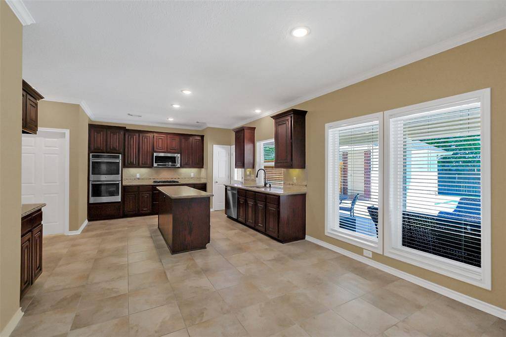 Large double paned windows bring in so much natural light into this great size kitchen.