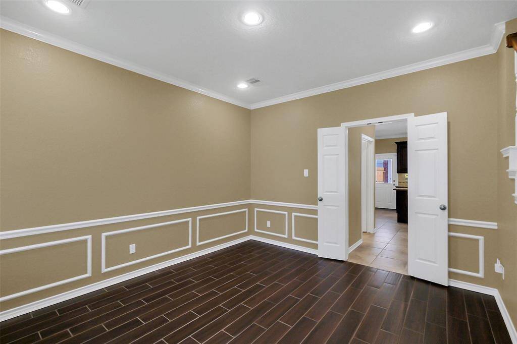 Dining room with entrance to kitchen.