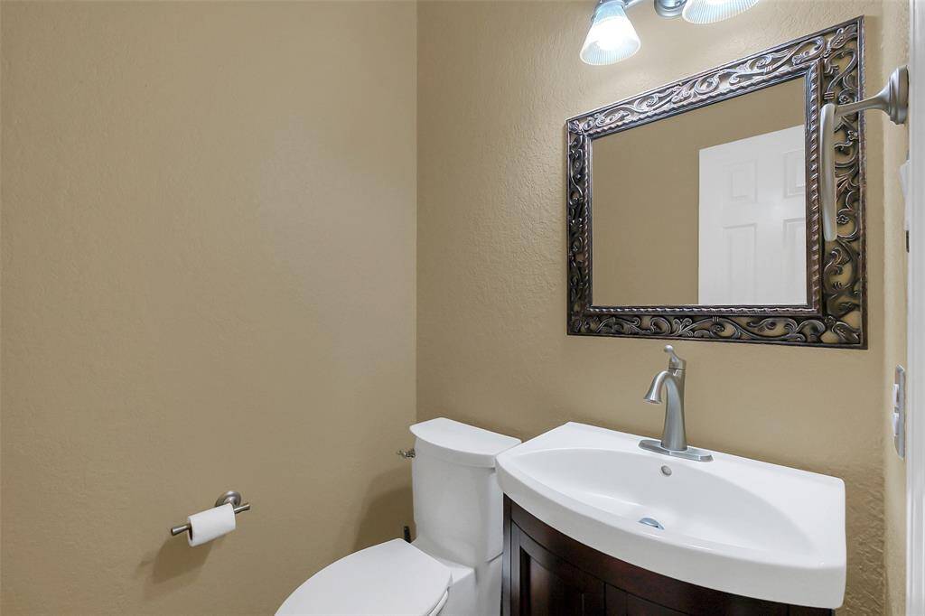 Half bath located off living room.
