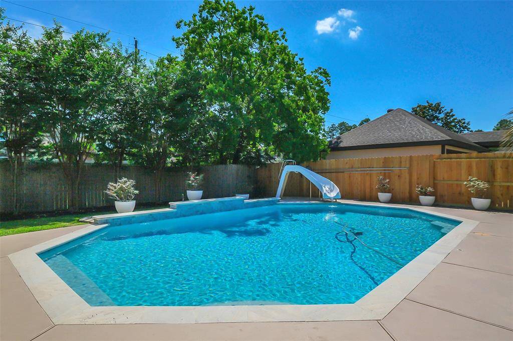 Large pool with new coping, tile and plaster.