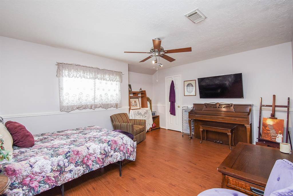 A higher placed double window in this secondary bedroom offers more space options.