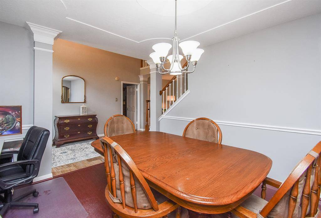 What a nice, open view from dining (or perhaps, office space?) to the main entry hallway, and staircase.