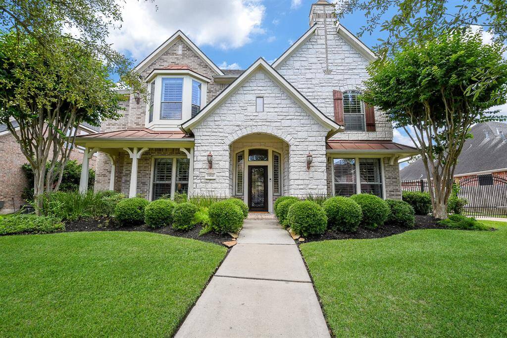 Incredibly beautiful & updated home in the popular master planned community of Gleannloch Farms. Brick & stone exterior, and NO BACK NEIGHBORS!