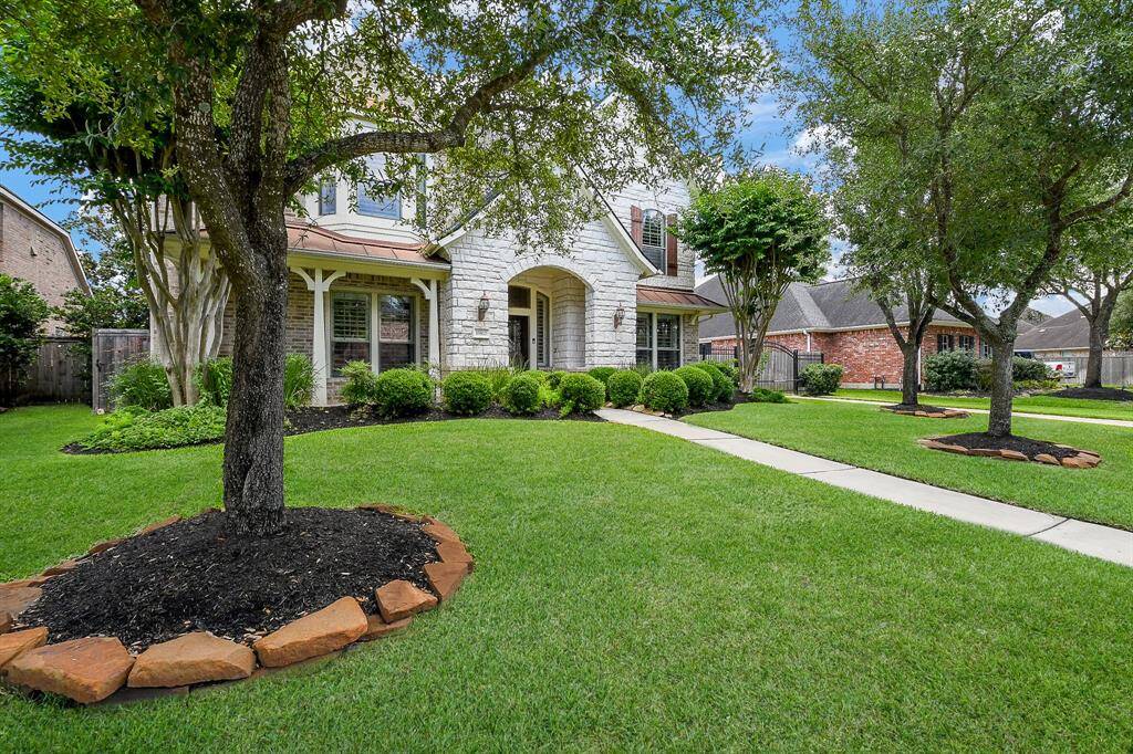Verdant grounds are maintained by an automatic sprinkler system. Set it and forget it!