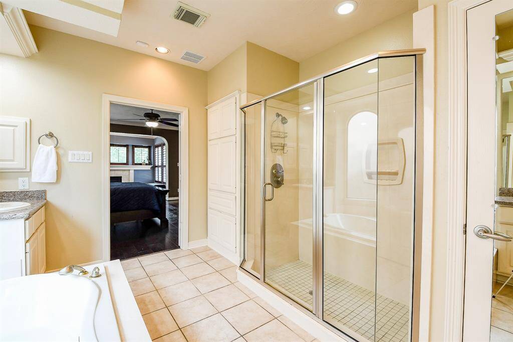 Here is a look at the shower and linen cabinets.
