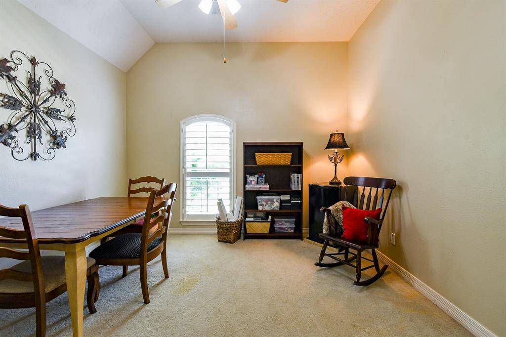 This bedroom is located at the front of the house, and the Sellers are currently using it as a crafts room.  It is large room with high ceilings and a large walk-in closet + ceiling fan.