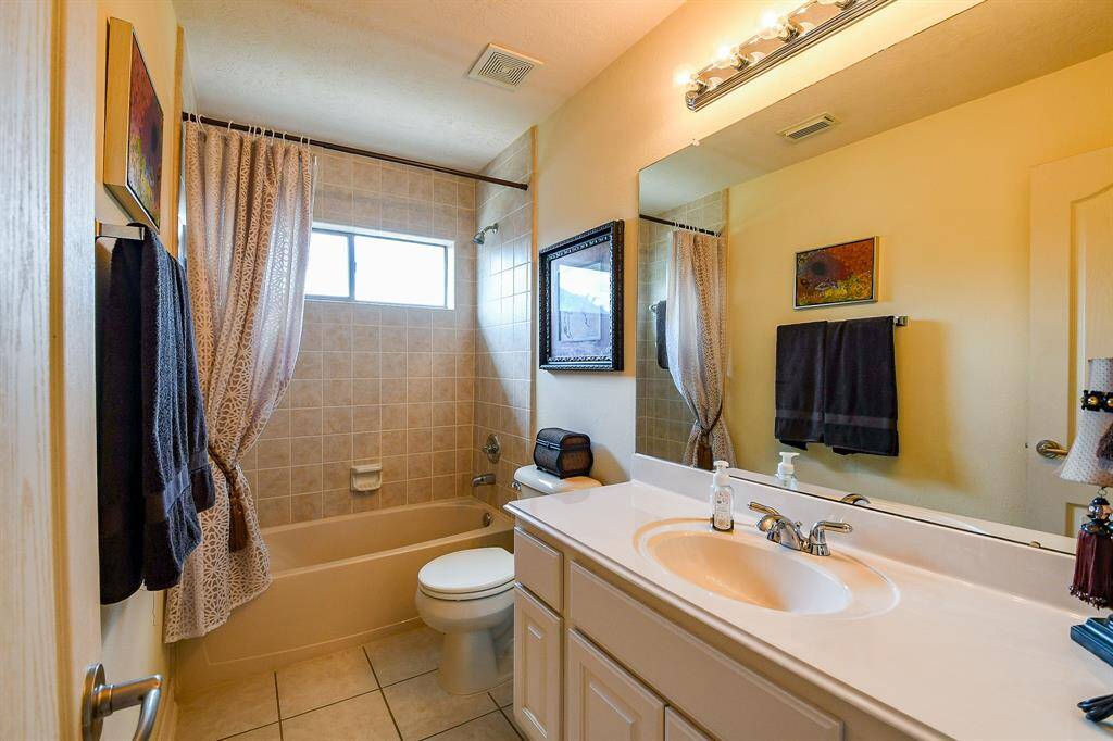 This is a full bathroom just outside the bedroom in the preceding picture.  This bathroom is the one closest to the game room as well.