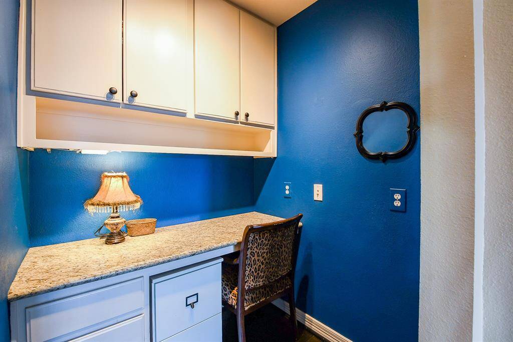 A closer look at the office / study nook.  This area features cabinets and even granite counters.  Perfect bill-paying station or study area for your kids.