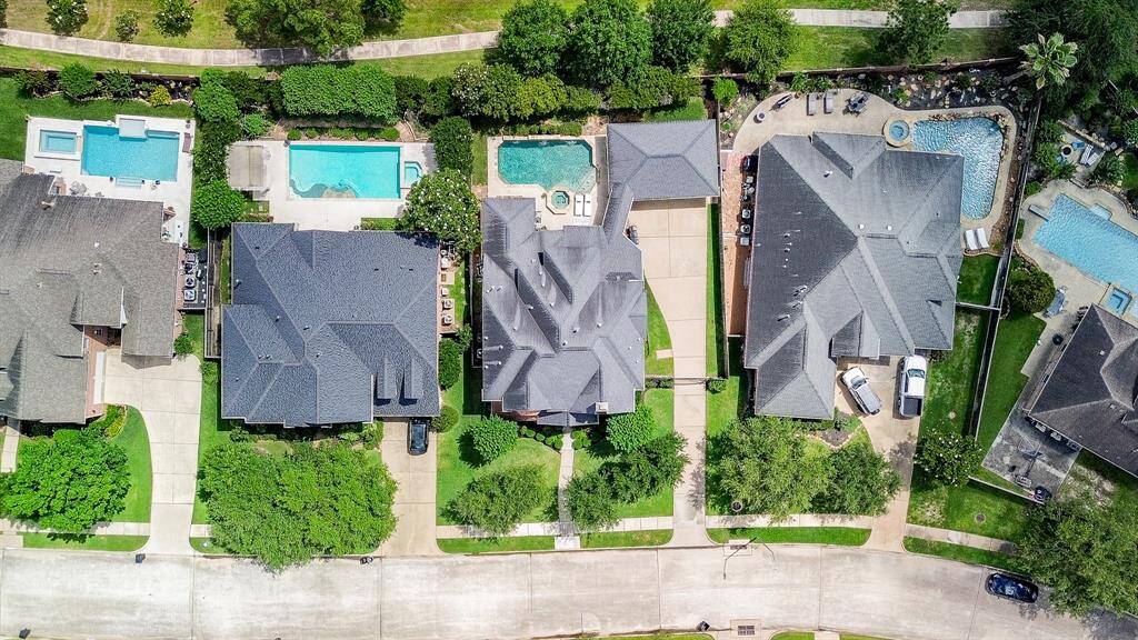 Birds eye view of this incredible property with no back neighbors!  All the homes in this area are well-maintained as you can plainly see.  There is a walking trail and green space directly behind the home (maintained by the HOA).