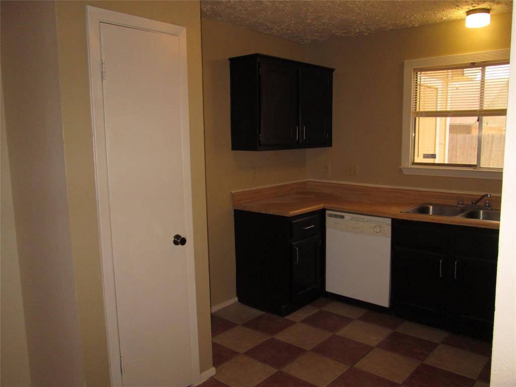 Half bath off the hallway serves living area and 2nd bedroom