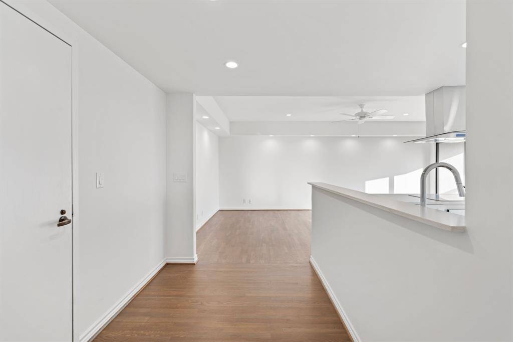 Entry looking towards the living room with solid hardwood floors.