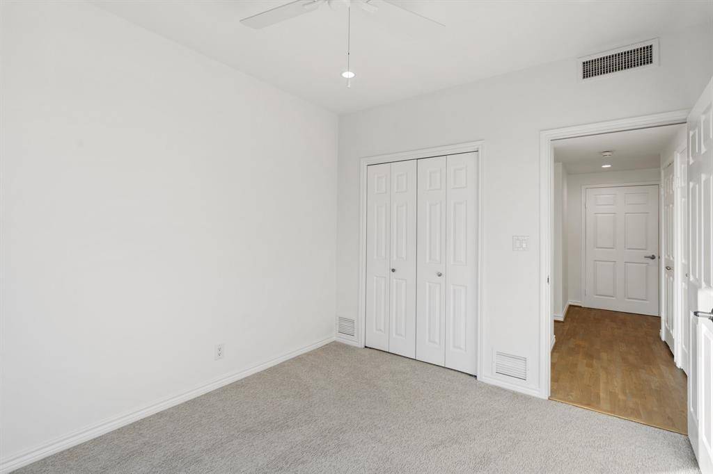 Entry to the second bedroom with closet.