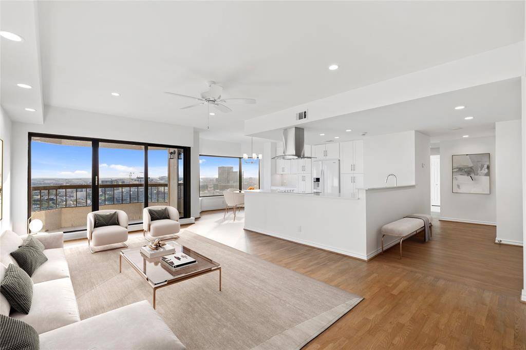 Completely renovated with an open concept and real solid hardwood floors. Image shown virtually staged.