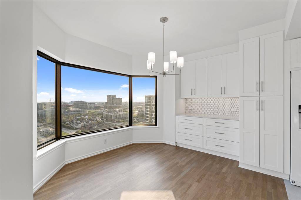 Dining area with crisp white finishes and clean lines throughout.