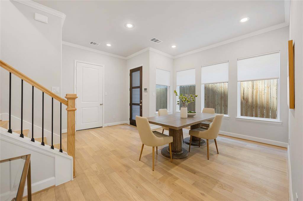 From a different view, the dining room showcases its spacious layout, perfect for hosting gatherings with elegance.
