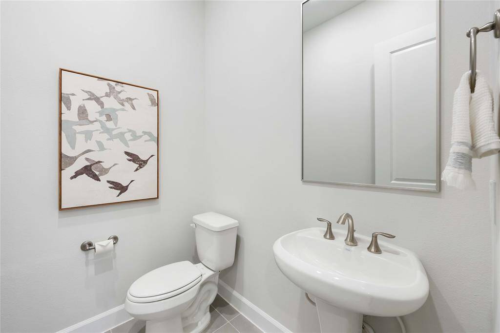 The conveniently located first floor powder room.