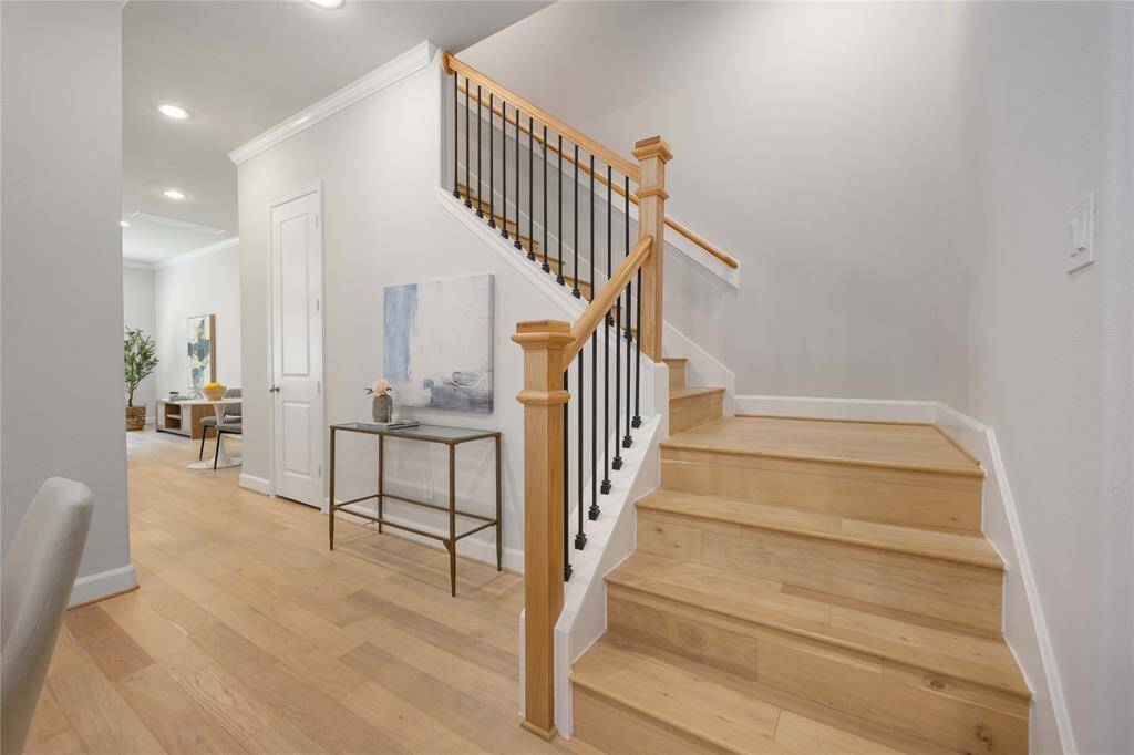 Head upstairs to the bedrooms and gameroom.