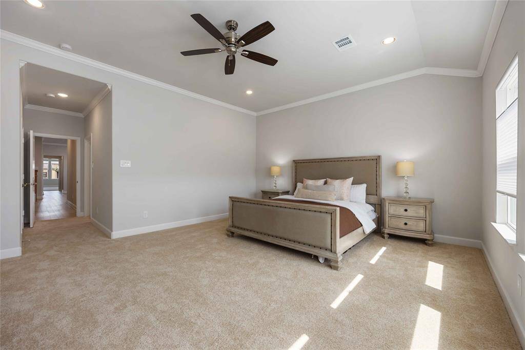 From this angle, you can see the door leading to the ensuite bathroom, as well as the hallway that connects to the game room and additional bedrooms.