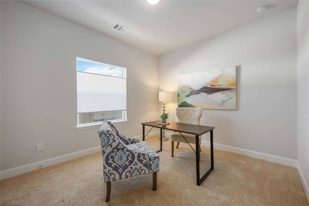 One of the secondary bedrooms located on the second floor.