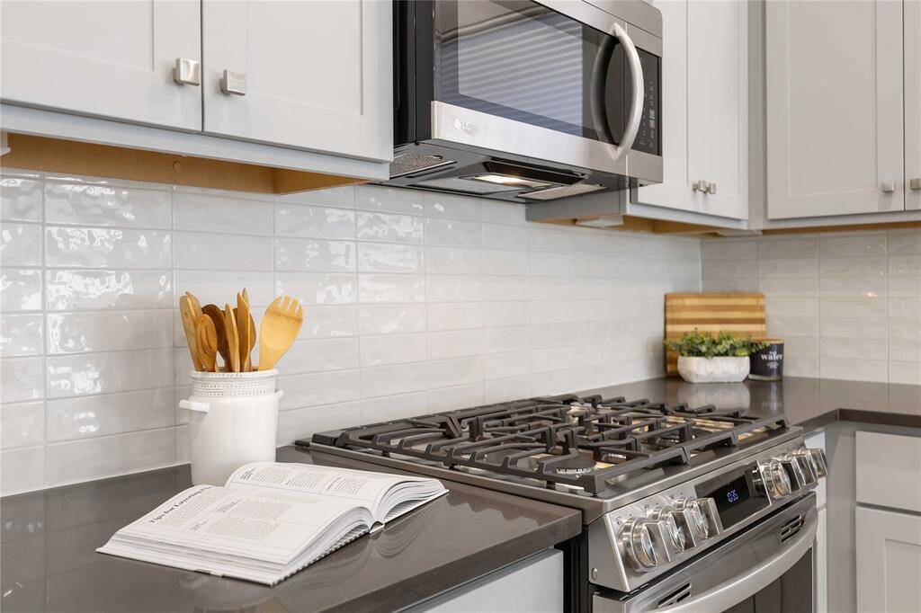 A five-burner natural gas range, makes cooking a delight.