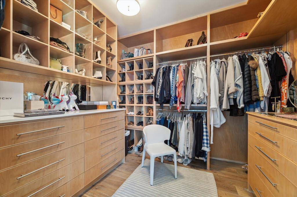 One of two custom built closets for the primary suite.