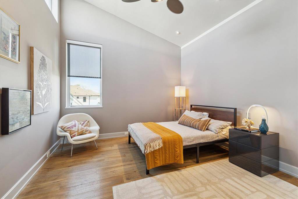 Second upstairs bedroom. One thing you will note as you tour the secondary bedrooms, the attention to detail is extensive. Custom built in cabinets in the closet, designer fan and perfectly chosen paint colors enhance all the spaces.