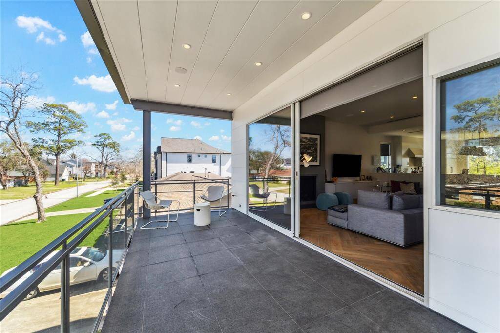 Another view of the living room that effortlessly blends with the heart of the home, the kitchen.