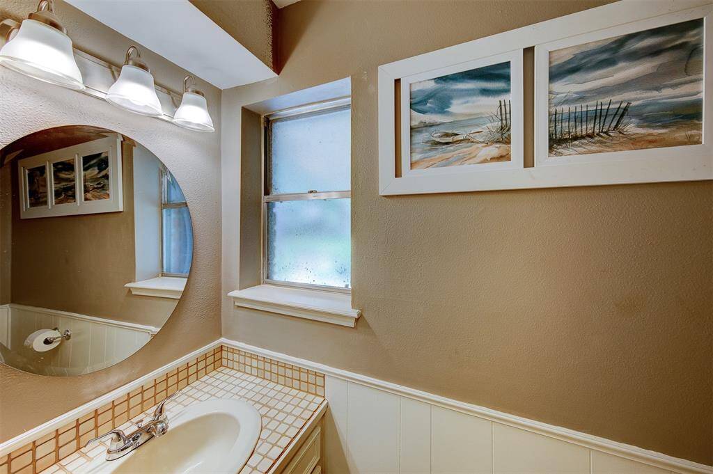 Half bath next to the laundry room, leading out to the back yard.
