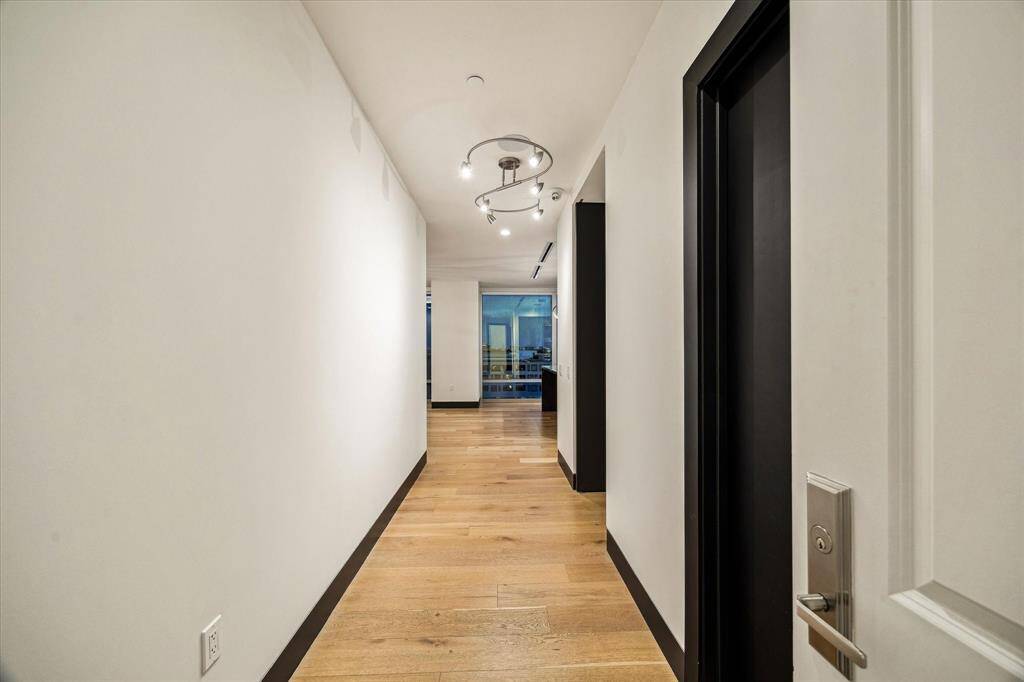 Step through the front door into a warm, inviting entryway filled with natural light, hardwood floors, and charming details that instantly feel like home.