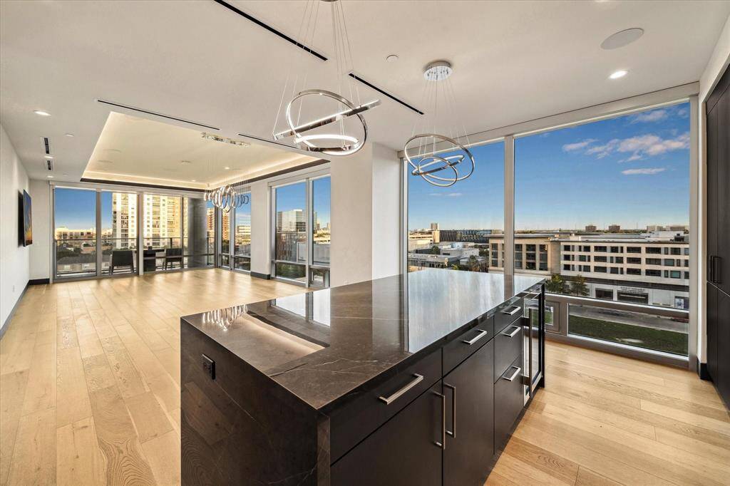 A sophisticated high-rise condo crafted by renowned Pelican Builders, showcasing timeless design, upscale finishes, and breathtaking city views.