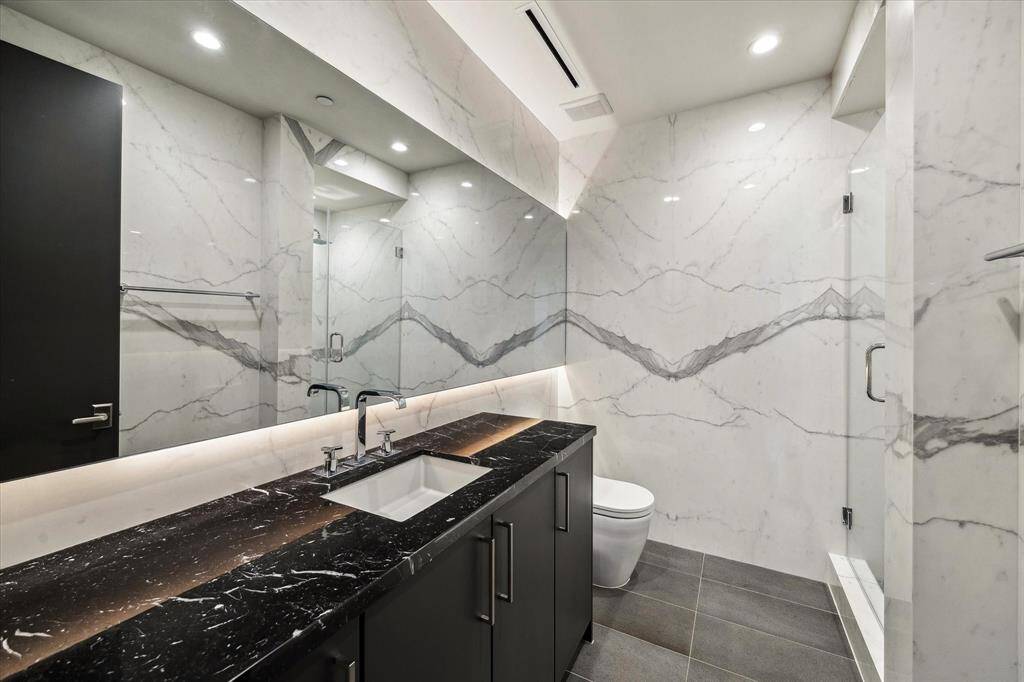 Your secondary full bathroom is surprisingly spacious—perfect for getting ready in style and comfort, whether it's a busy morning or a relaxing evening routine!
