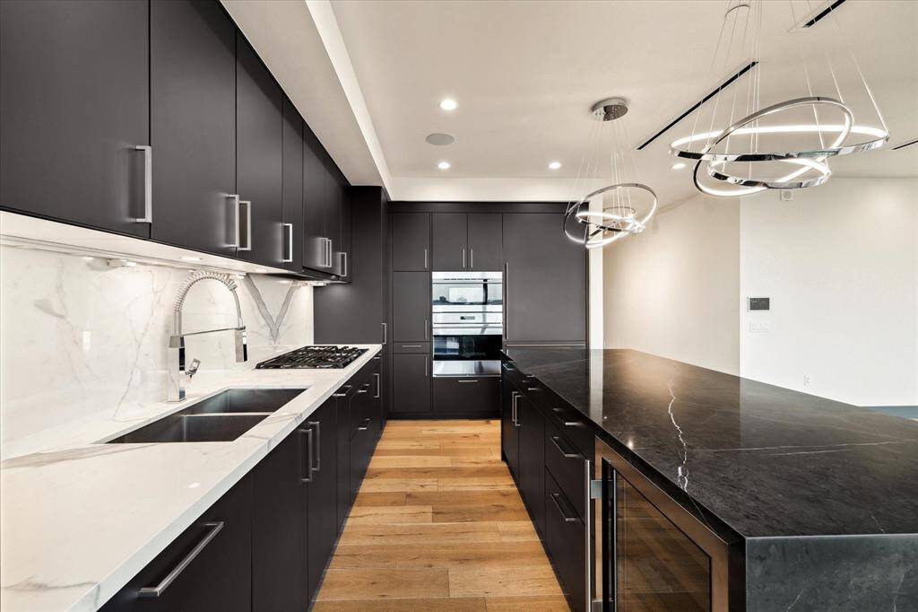 Outfitted with state-of-the-art Wolf and Sub-Zero appliances, this kitchen delivers professional-grade performance with sleek, modern style.