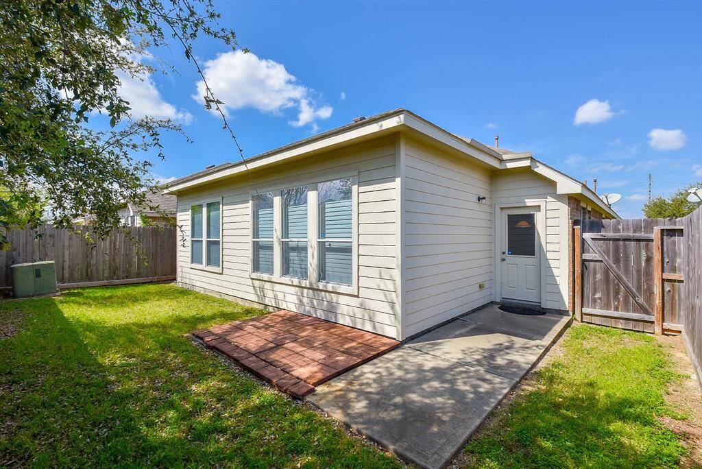 Backyard with area for furniture or grill