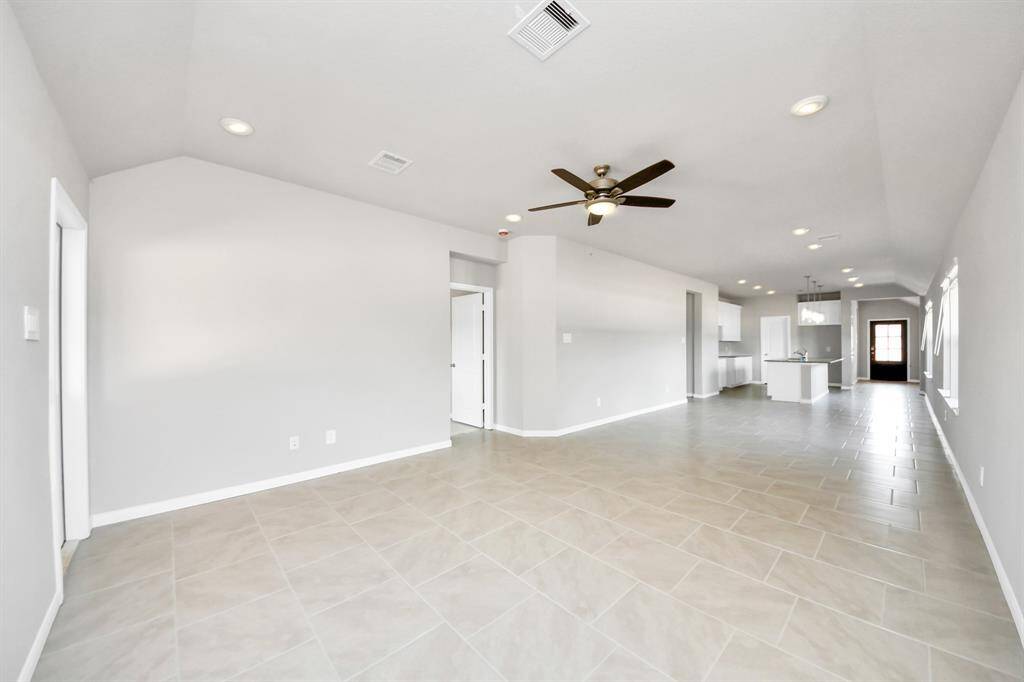 Take another glimpse into the heart of the home with this additional view of the family room—a sprawling space ready to accommodate all your gatherings.