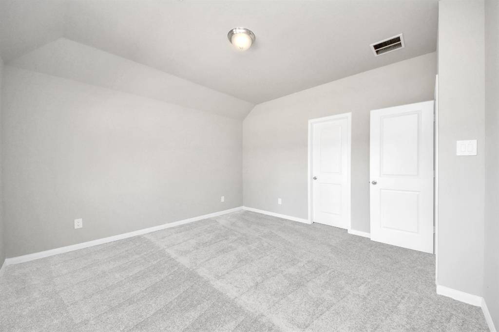 Come and unwind after a long day in this magnificent primary suite! This spacious room features plush carpet, warm paint, high ceilings and large windows with privacy blinds.