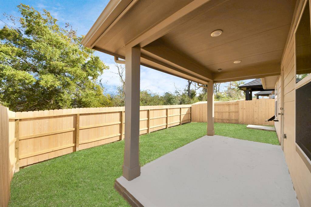 Experience outdoor living at its finest on this expansive covered patio, thoughtfully designed for BBQs and delightful outdoor dining