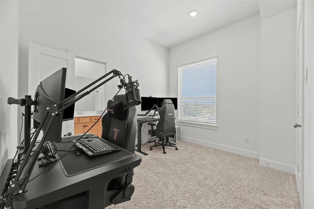 Secondary bedroom is currently furnished as a home office.