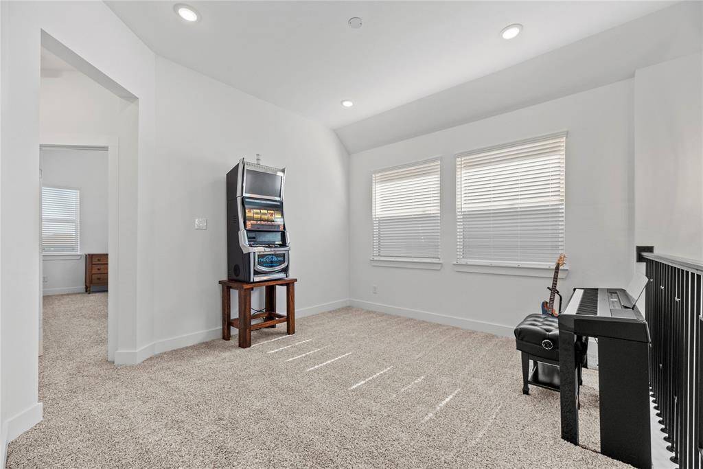 Versatile upstairs game room.