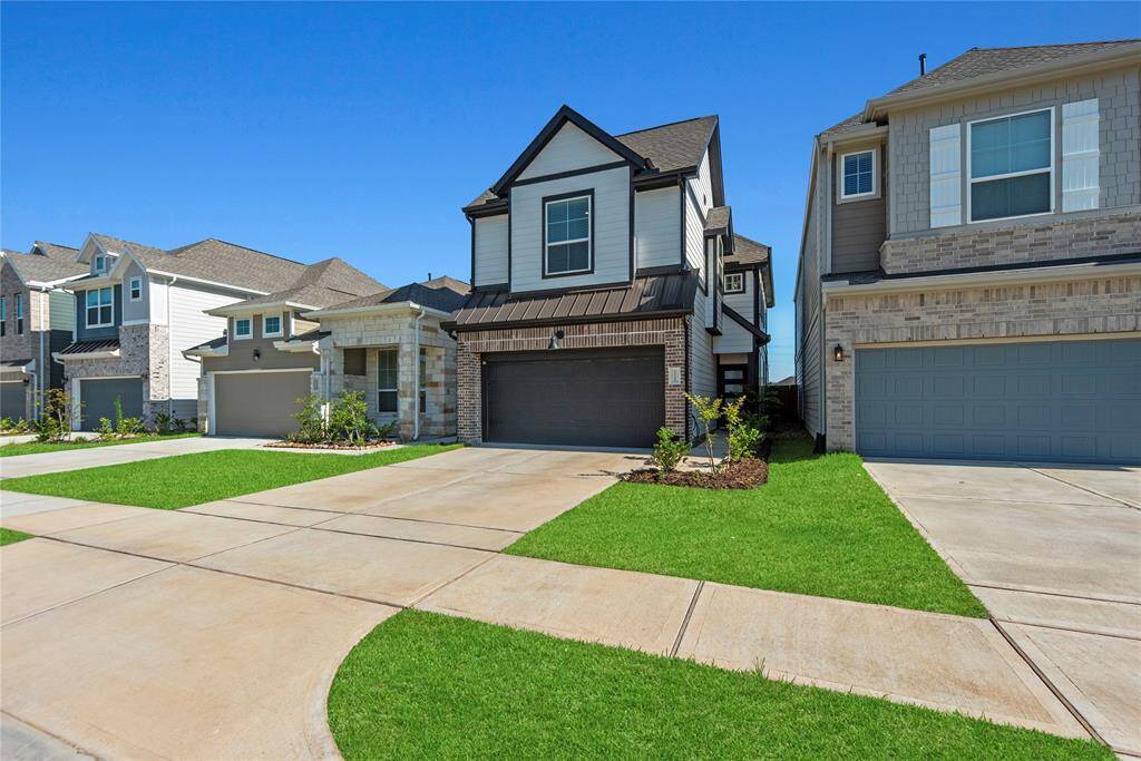 Plenty of parking with an attached 2-car garage, a double-wide driveway and a Liftmaster Wi-Fi garage door opener.