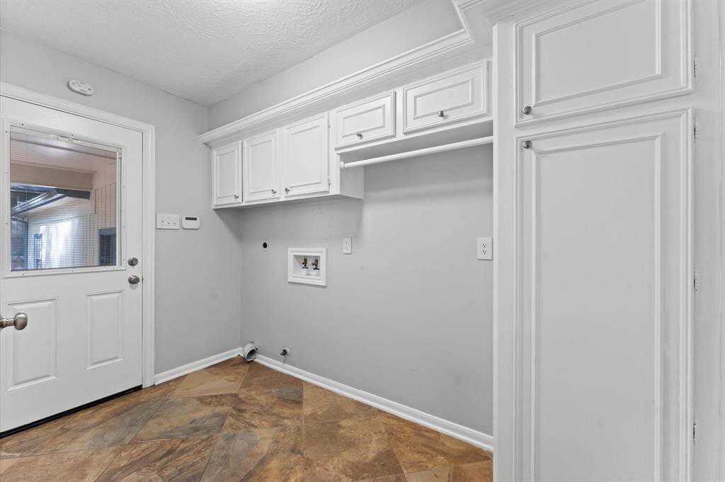 Laundry Room is located adjacent to kitchen.