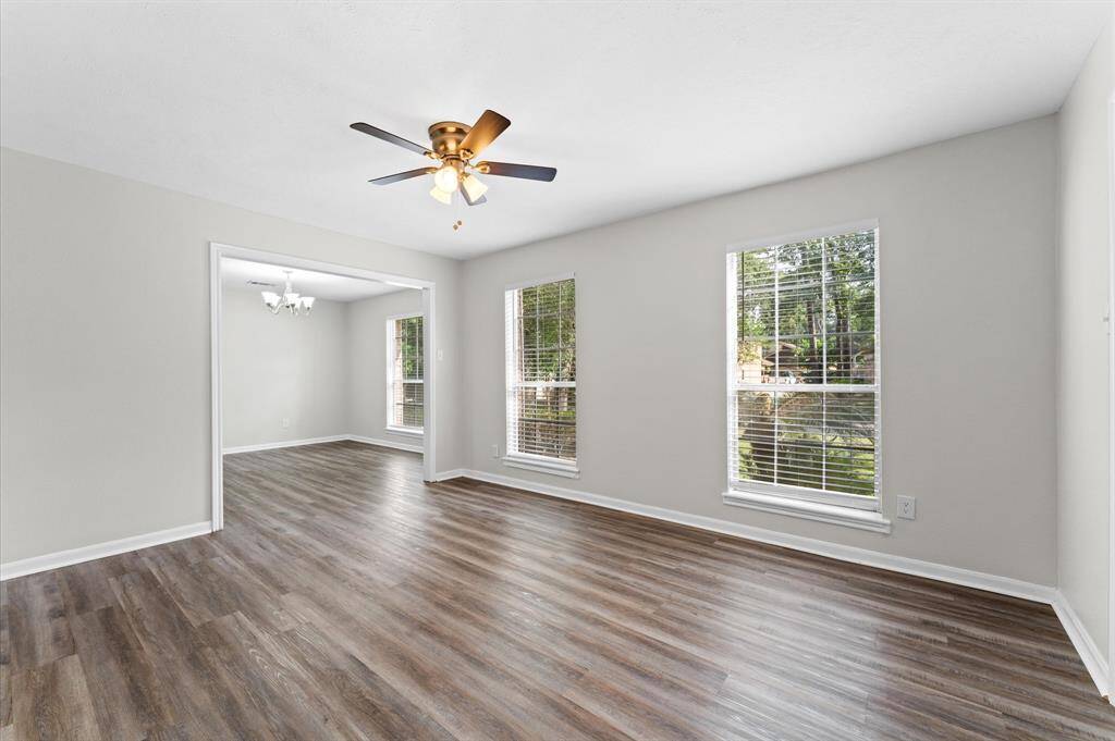 To the right of entry you are met with a spacious formal living and dining room; perfect for entertaining or cozy gatherings.