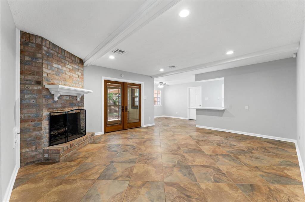 The walls are adorned in a stylish gray-toned paint, adding a modern touch while complementing the home's classic charm.