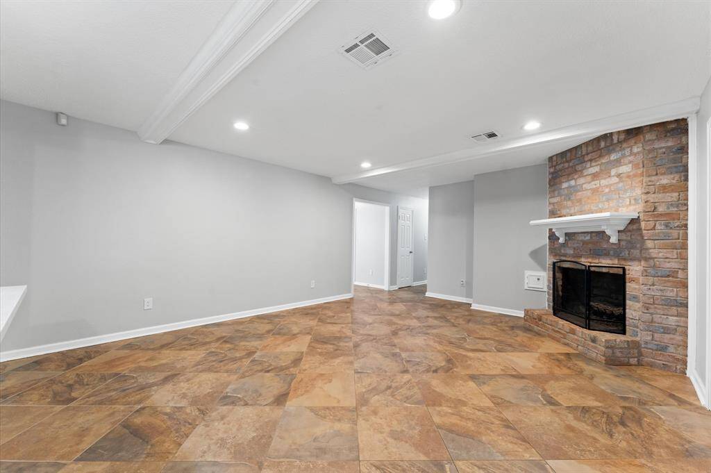 The kitchen features stunning white sparkling quartz countertops, complemented by white shaker style cabinets. (Seller is looking into matching drawer replacement for the one that is missng.)