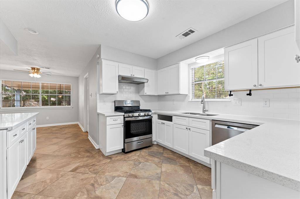 Plenty of counter and cabinet space in this kitchen.