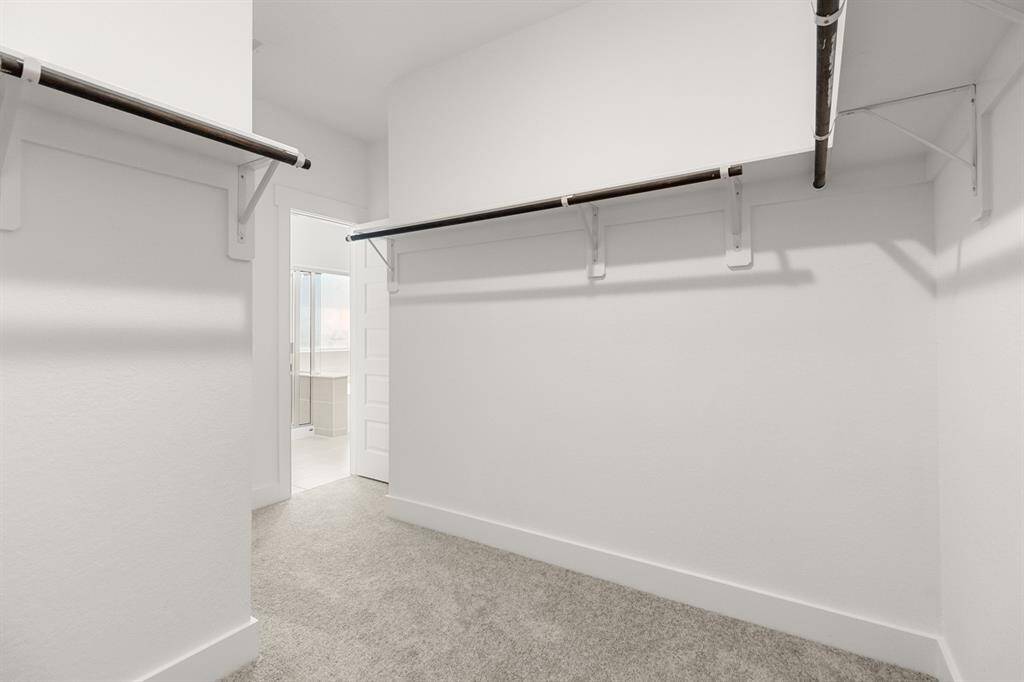This well appointed primary closet will help you stay organized throughout each season.