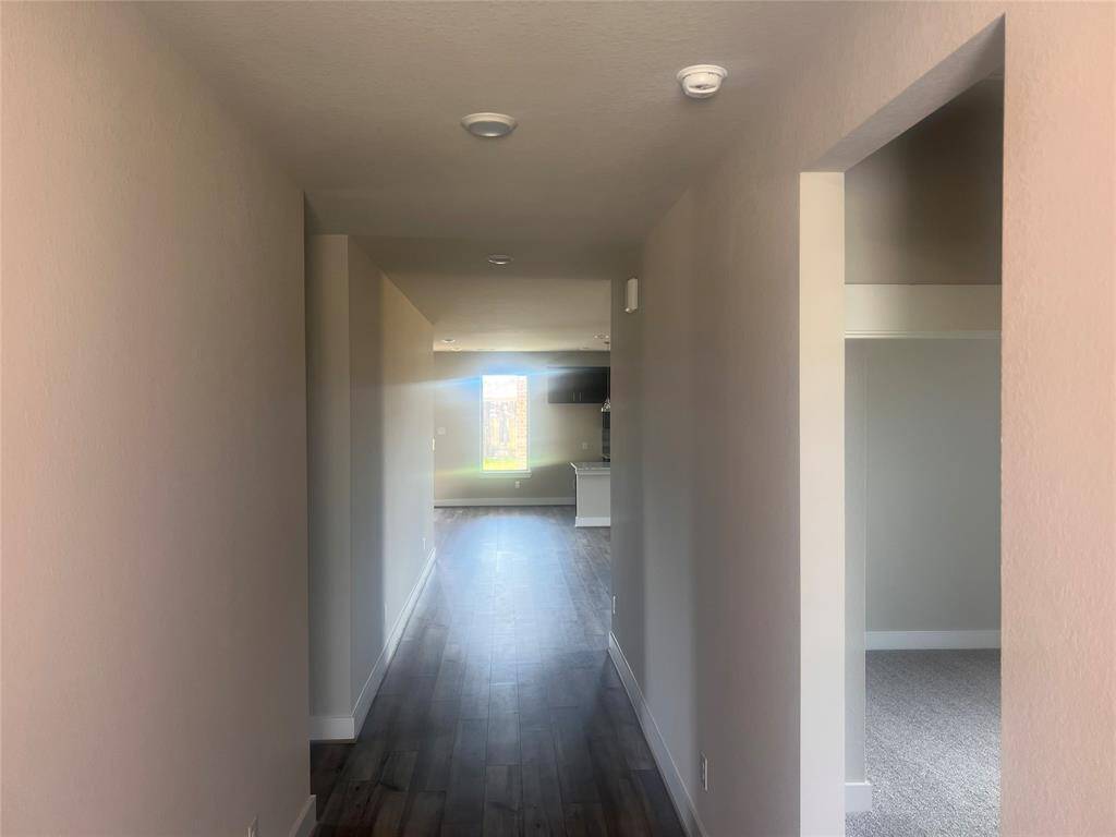 The first thing you’ll notice is the warm, natural light pouring in through large windows, creating a cheerful ambiance that instantly makes you feel at home.