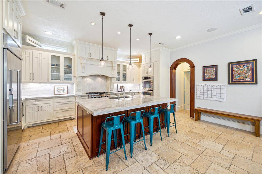 Another angle of the spacious kitchen, featuring double ovens that make cooking a breeze.
